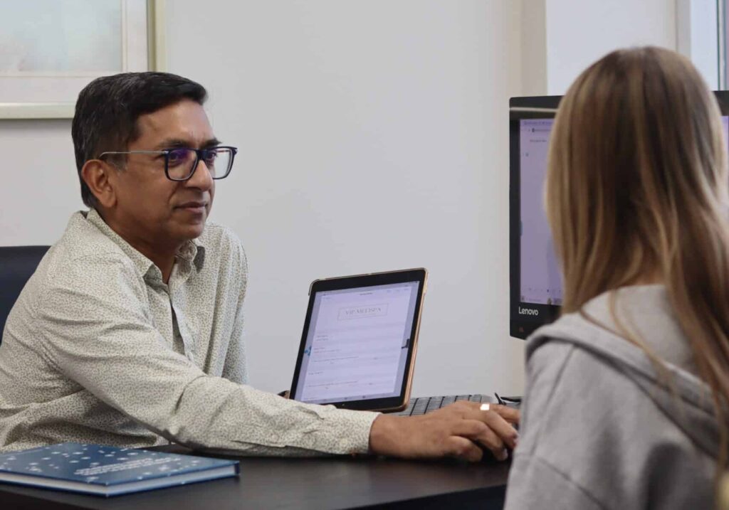 Dr. Seegobin in a consultation with a client