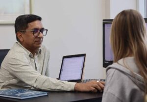 Dr. Seegobin in a consultation with a client