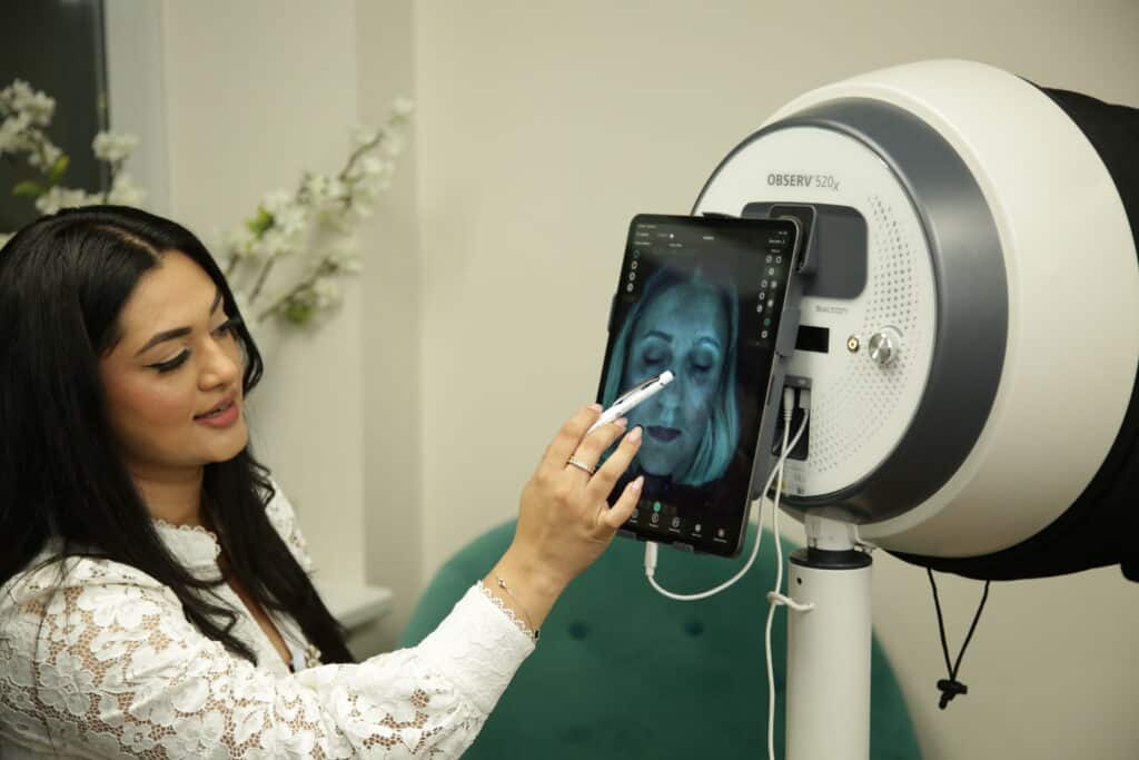 Nurse Laura conducting a skin analysis